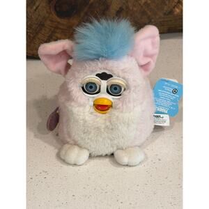 1999 Furby Baby manufactured by Tiger Electronics with tags
